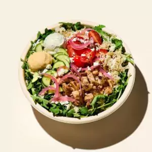 Chicken Rice with tender grilled chicken served over seasoned rice and fresh vegetables.