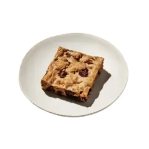Greyston Blondie from Cava menu – soft, chewy blondie bar with rich flavors of brown sugar and vanilla.
